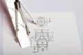 Drawing on a white paper. Above it is a compass. pencil and ruler. Hang in space Royalty Free Stock Photo