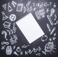 Drawings on the chalkboard on the new academic year, fall, school supplies, drawn around a notebook with pencil, place for text, Royalty Free Stock Photo