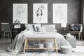 Drawings in monochromatic bedroom interior