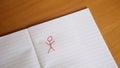 Drawings of stickman and woman appear on paper