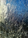 Drawings of winter on the window. Ice patterns on glass Royalty Free Stock Photo