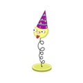 Funny yellow cartoon spring on a stand - with eyes, mouth and head in a festive burgundy cap