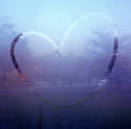 Drawn heart on the wet glass. Love Royalty Free Stock Photo