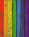 The boards of a fence painted in colors of a rainb Royalty Free Stock Photo