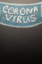 A drawn mask on a blackboard with the inscription Coronavirus. News headline, articles. Epidemic and pandemic, problems in