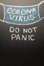 A drawn mask on a board with the inscription coronavirus. Headline in the news, articles. Epidemic and pandemic, problemma in