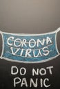 A drawn mask on a board with the inscription coronavirus. Headline in the news, articles. Epidemic and pandemic, problemma in