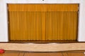 Drawn curtains on small school assembly stage