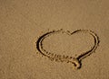 Drawn in the sand heart - a sign of love! Royalty Free Stock Photo