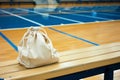 drawstring bag on a gym bleacher, basketball court insight