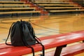drawstring bag on a gym bleacher, basketball court insight