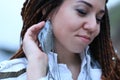 Dreadlocks fashionable girl posing with earring