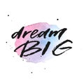 Dream big hand drawn lettering on violet and blue watercolor splash