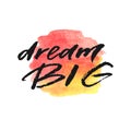 Dream big hand drawn lettering on watercolor splash in red and yellow colors.