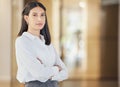 Dream big and make it happen. Portrait of a confident young businesswoman standing with her arms crossed in an office. Royalty Free Stock Photo