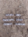 Dream big sparkle more shine bright written on sand at the beach Royalty Free Stock Photo