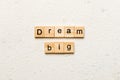 Dream big word written on wood block. Dream big text on cement table for your desing, Top view concept Royalty Free Stock Photo