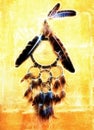 Dream catcher with eagle and raven feathers on orange structure wall, fractal effect.