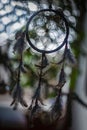 Dream catcher with feathers threads and beads rope hanging and nice bokeh background Royalty Free Stock Photo