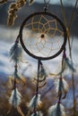 Dream catcher with feathers threads and beads rope hanging and nice bokeh background Royalty Free Stock Photo