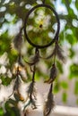 Dream catcher with feathers threads and beads rope hanging and nice bokeh background Royalty Free Stock Photo