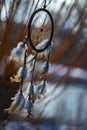 Dream catcher with feathers threads and beads rope hanging and nice bokeh background Royalty Free Stock Photo