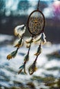 Dream catcher with feathers threads and beads rope hanging and nice bokeh background Royalty Free Stock Photo