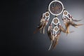 Dream catcher with feathers threads and beads rope hanging spiritual folk american native indian amulet isolated on black Royalty Free Stock Photo