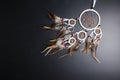 Dream catcher with feathers threads and beads rope hanging spiritual folk american native indian amulet isolated on black Royalty Free Stock Photo