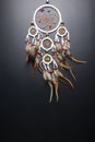 Dream catcher with feathers threads and beads rope hanging spiritual folk american native indian amulet isolated on black Royalty Free Stock Photo