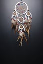 Dream catcher with feathers threads and beads rope hanging spiritual folk american native indian amulet isolated on black Royalty Free Stock Photo