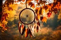 A dream catcher framed by the vibrant hues of autumn leaves, with a soft breeze causing the feathers to sway gently in the forest