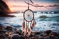 A dream catcher gently swaying in a coastal breeze, against a backdrop of crashing waves and a pastel-colored sky during twilight