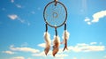 Dream catcher on hand with blue sky background. It is swing by wind.It is made from the feather, bead,leather and rope.The amulet Royalty Free Stock Photo