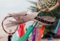 Dream catchers develop in the wind against the backdrop of the beach. A lot of space in the frame creates a feeling of calm and