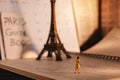 Dream Destination for Vacation. Travel in Paris, France. a Miniature Tourist Woman Looking at the Eiffel Tower and Calendar. Warm