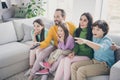 Dream harmony family spending time concept. Five people dad daddy mom mommy three kids boy girls sit divan watch tv Royalty Free Stock Photo