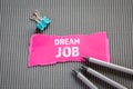 DREAM JOB. Career, education and job interview concept. Text on torn, colored paper Royalty Free Stock Photo