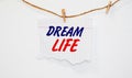 Dream Life card with a beach on background