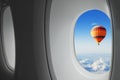 Surprise, dream travel, hot air balloon flying in sky  seen from window of airplane Royalty Free Stock Photo