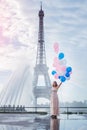 Dream travel - young woman with balloons walking near Eiffel Tower in Paris Royalty Free Stock Photo