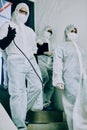 The dream virus fighting team. a group of healthcare workers wearing hazmat suits working together to control an