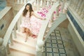 Dream wedding, beautiful bride, walking down stairs with flowers Royalty Free Stock Photo