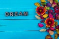 Dream word on blue wood with flower Royalty Free Stock Photo