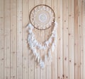 Dreamcatcher, american native decoration on wooden background