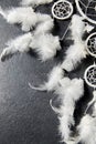 Dreamcatcher on dark slate stone background