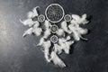 Dreamcatcher on dark slate stone background