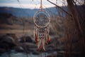 dreamcatcher hanging in front of a nature scene