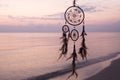 Dreamcatcher, on sea background, magical indian shaman amulet, mystical. Boho