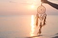 Dreamcatcher, on sunrise sea background, magical indian shaman